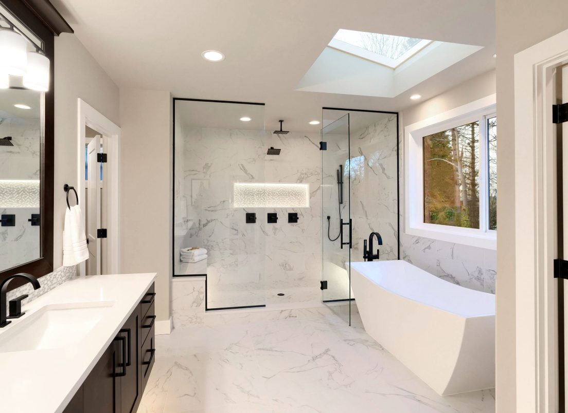 Bathroom remodel with skylight and freestanding tub